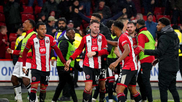 Sheffield United players pictured celebrating after scoring a late goal to beat Wolves 2-1 in November 2023